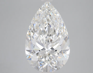 Pear-shaped lab-grown diamond with faceted surface and light refractions on neutral background.
