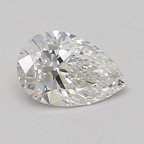 Pear-shaped lab-grown diamond with faceted surface displaying light refraction, approximately 0.71 carat.