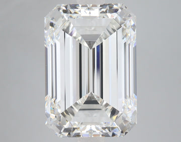 Clear emerald-cut diamond with stepped facets and bright reflections on neutral background.