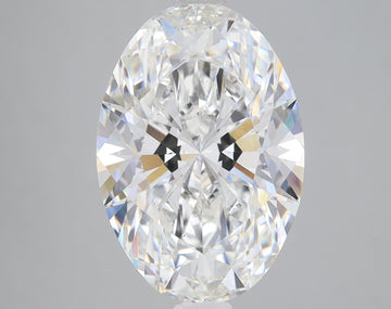 Oval-cut colorless diamond with faceted surface and light refraction visible throughout the stone.