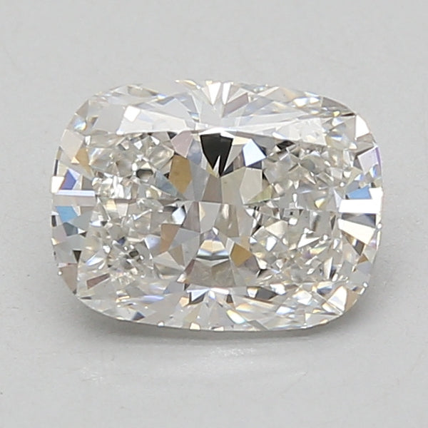 Cushion-cut lab-grown diamond with faceted surfaces reflecting light, displaying a clear to near-colorless appearance.