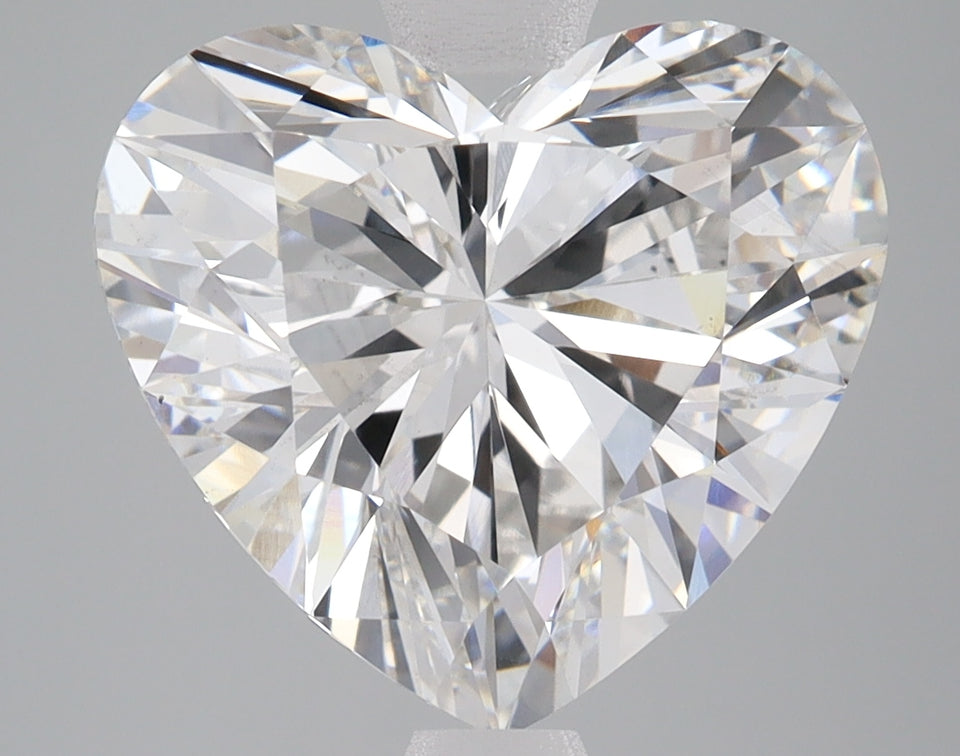 Heart-shaped lab-grown diamond with brilliant faceting and light refraction visible throughout the stone.