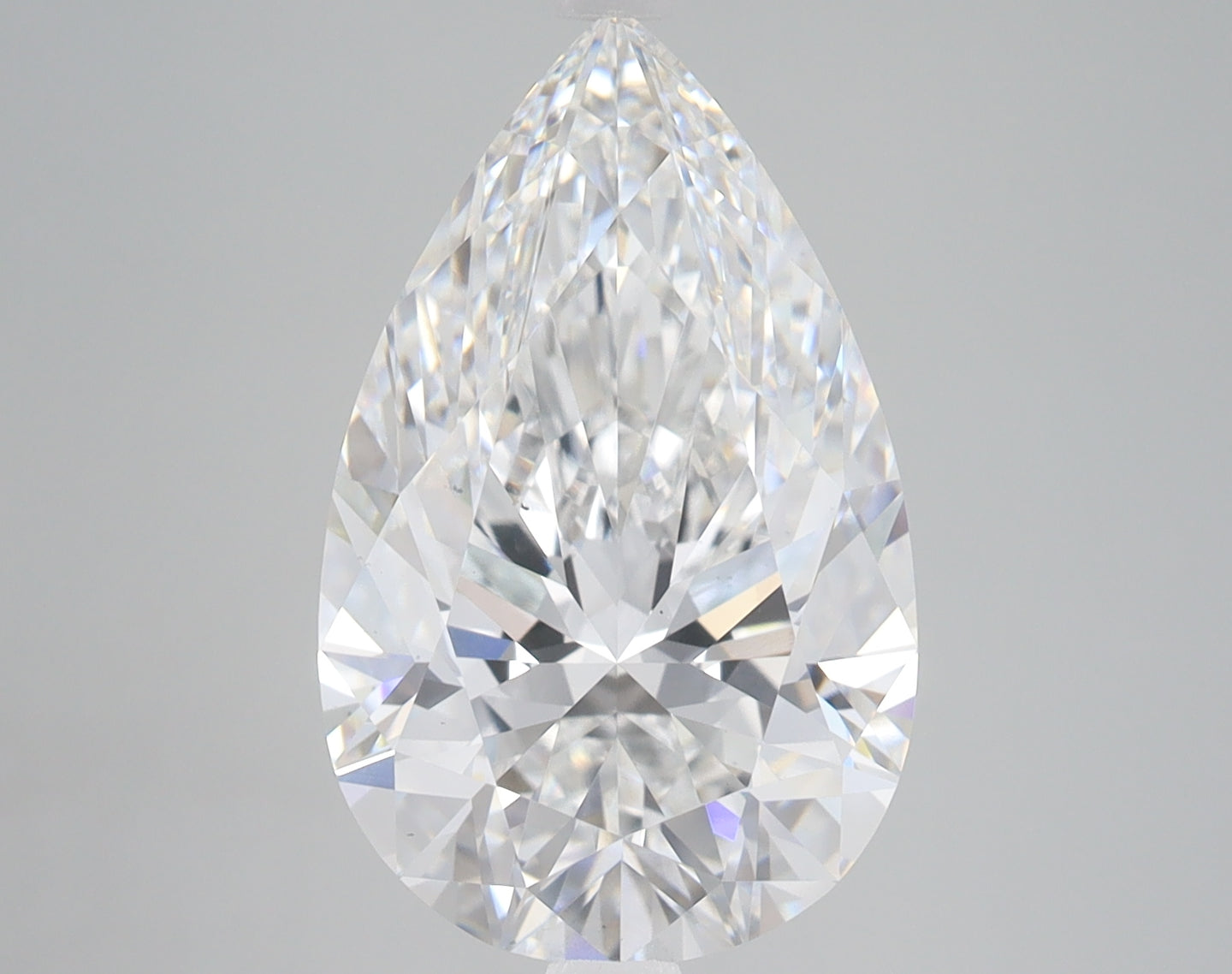 Pear-shaped lab-grown diamond with faceted surface and light refraction, displayed on neutral background.