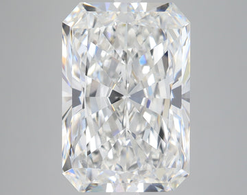 Clear radiant-cut loose diamond with brilliant faceting and light reflections on neutral background.