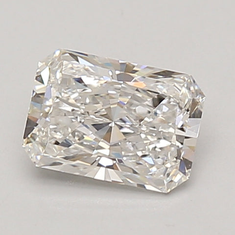 Radiant cut lab-grown diamond with faceted surfaces and light reflections, displayed on neutral background.