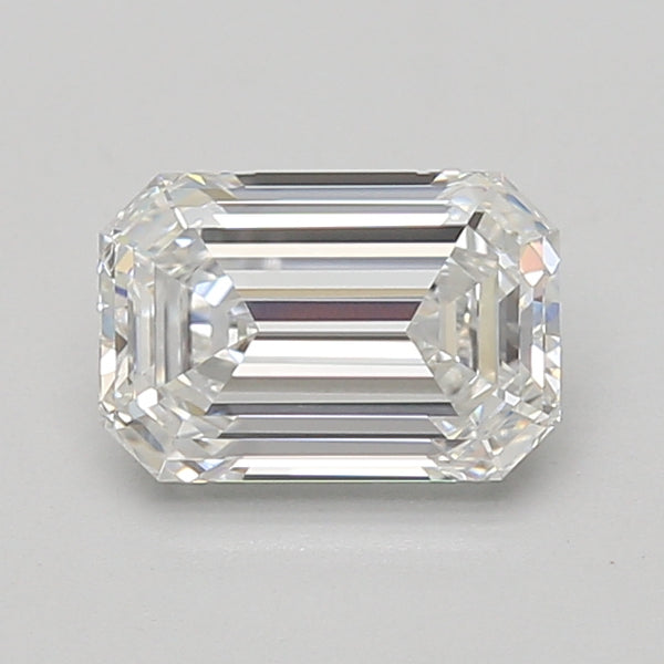 Clear emerald-cut lab-grown diamond with faceted surface and light reflections on neutral background.