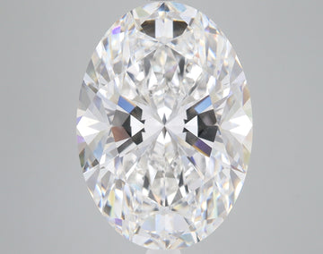 Oval-cut clear diamond with faceted surfaces reflecting light, displayed against a gray background.