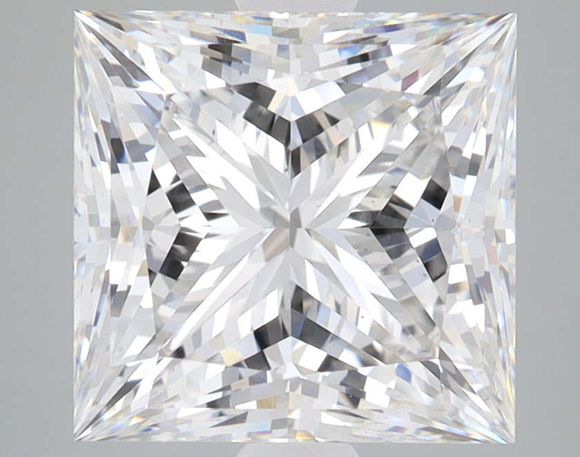 Clear princess-cut lab-grown diamond displaying multiple facets with bright light reflections on gray background.