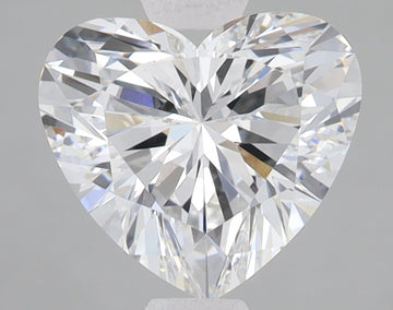 Heart-shaped lab-grown diamond with brilliant faceting and light refraction on neutral background.