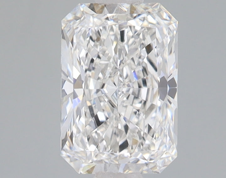 Clear radiant-cut loose diamond with faceted surfaces reflecting light, displayed against gray background.