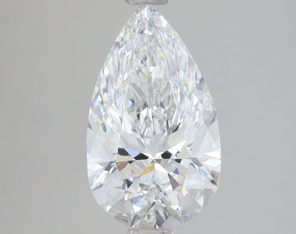 Pear-shaped lab-grown diamond with faceted surfaces and clear transparent appearance against neutral background.