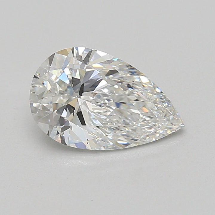 Pear-shaped clear lab-grown diamond with faceted surfaces reflecting light against a neutral gray background.
