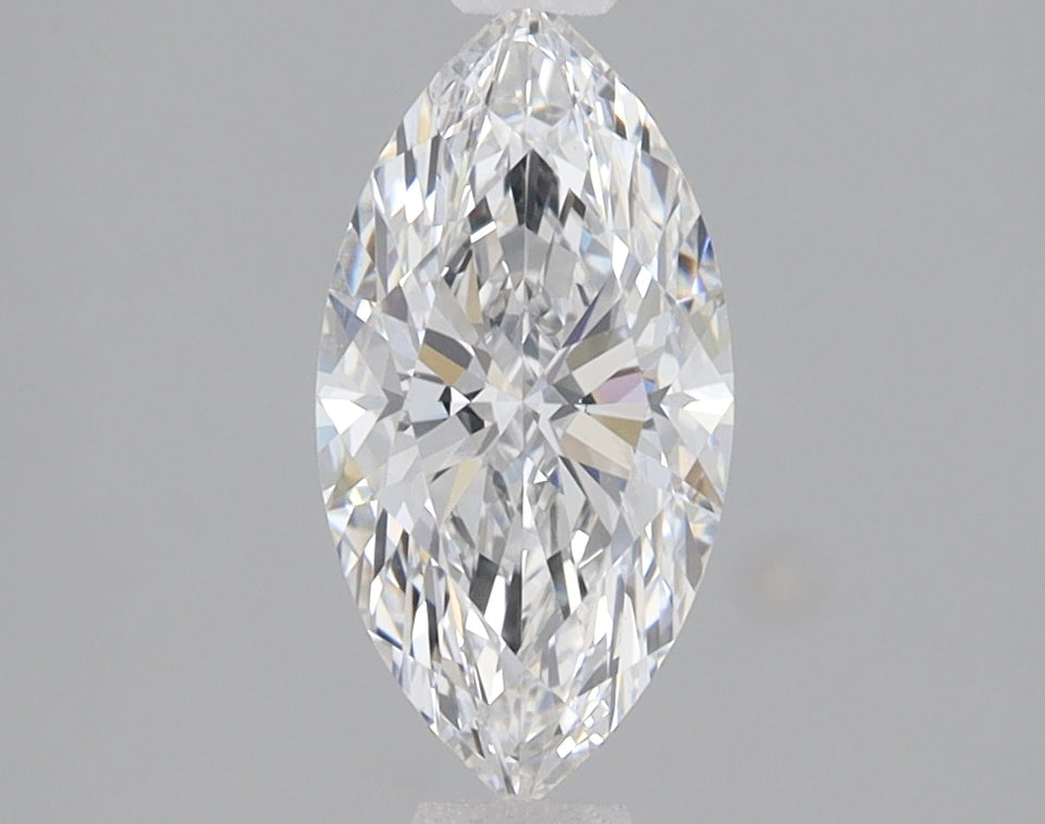 Marquise-cut clear diamond with faceted surfaces reflecting light against a gray background.