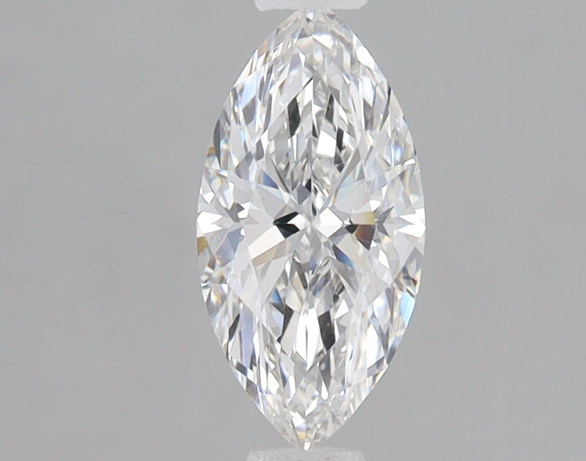 Clear marquise-cut diamond with faceted surfaces and light reflections on neutral gray background.