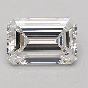Clear rectangular emerald-cut lab-grown diamond with faceted edges and reflective surfaces on neutral background.