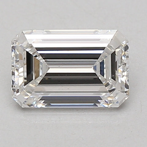 Clear rectangular emerald-cut lab-grown diamond with faceted edges and reflective surfaces on neutral background.