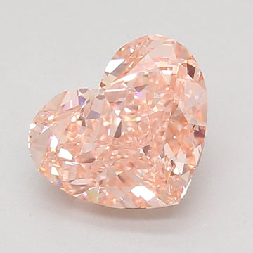 Heart-shaped lab-grown diamond with faceted surfaces and light peachy-pink coloring, displayed against a neutral background.
