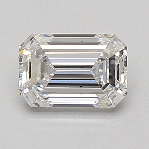Emerald-cut lab-grown diamond with faceted surfaces and clear appearance on neutral background.