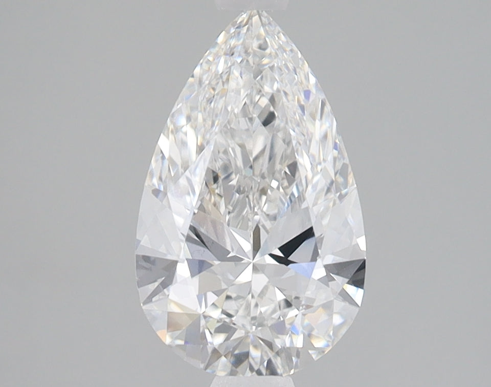 Pear-shaped lab-grown diamond with faceted surface displaying light refraction on neutral background.