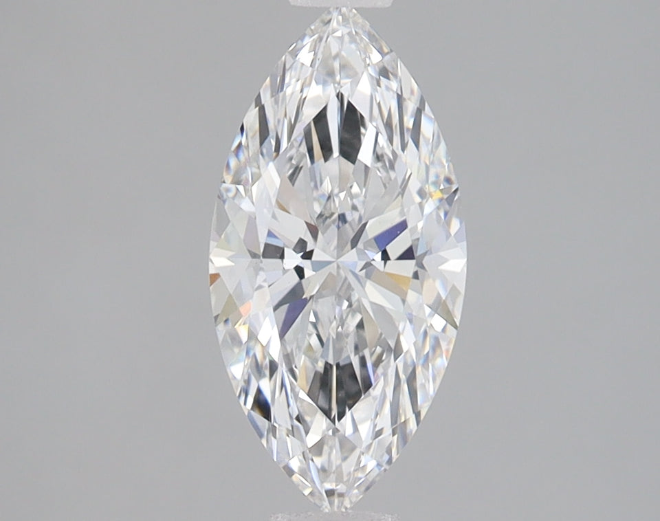 Marquise-cut clear faceted diamond with brilliant light refraction on neutral gray background.