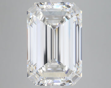 Emerald-cut lab-grown diamond loose stone with faceted surfaces and light reflections on neutral background.