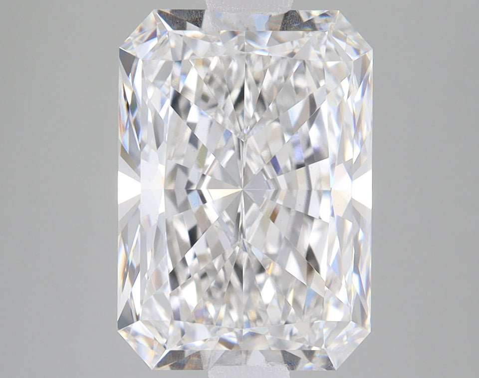 Radiant cut lab-grown diamond with clear faceting and light reflections on neutral background.