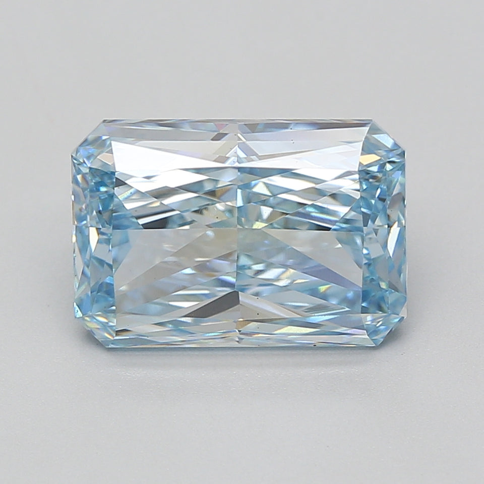 Radiant cut lab-grown diamond with faceted surfaces displaying light refraction and blue-tinted clarity.