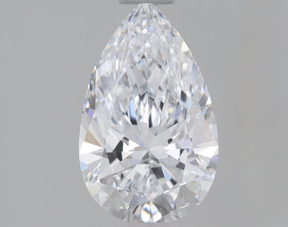 Pear-shaped lab-grown diamond with faceted surface and bright light reflections on neutral gray background.