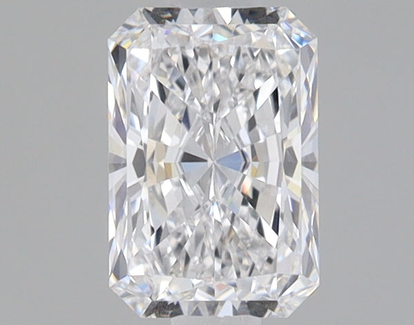 Colorless radiant-cut loose diamond with faceted surfaces reflecting light on neutral gray background.