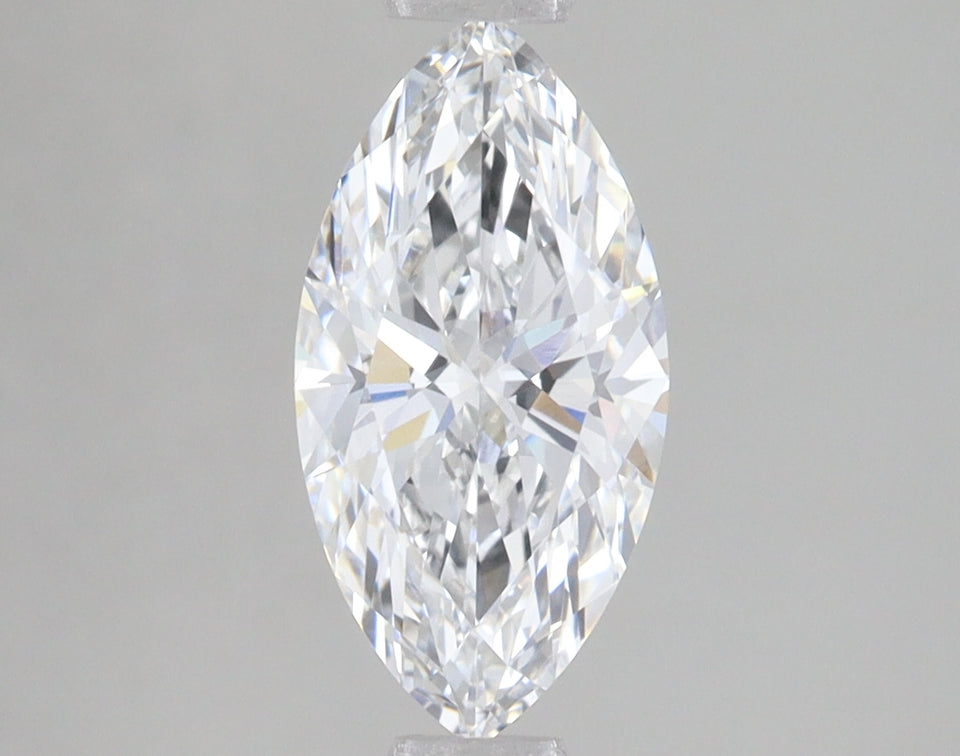 Marquise-cut lab-grown diamond with faceted surfaces and light reflections on neutral background.