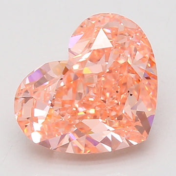 Heart-shaped lab-grown diamond with peachy-pink coloring and faceted surface, displayed against neutral background.