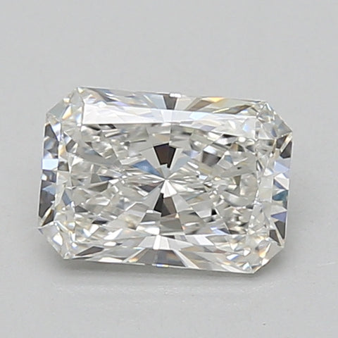 Radiant cut loose diamond with clear faceting and light reflection on neutral background.
