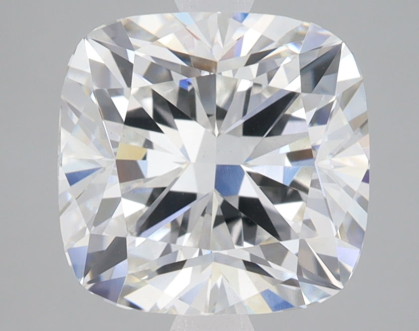 Cushion-cut lab-grown diamond with brilliant faceting and light reflections on neutral background.