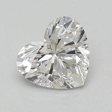 Heart-shaped transparent diamond with faceted surface and light reflections on gray background.