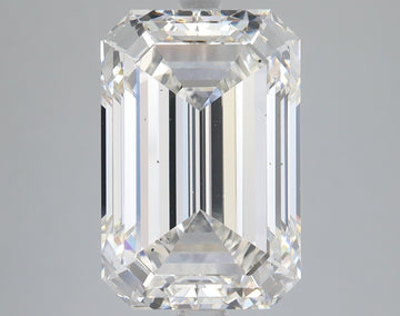 Emerald-cut lab-grown diamond with clear facets and light reflections on neutral background.