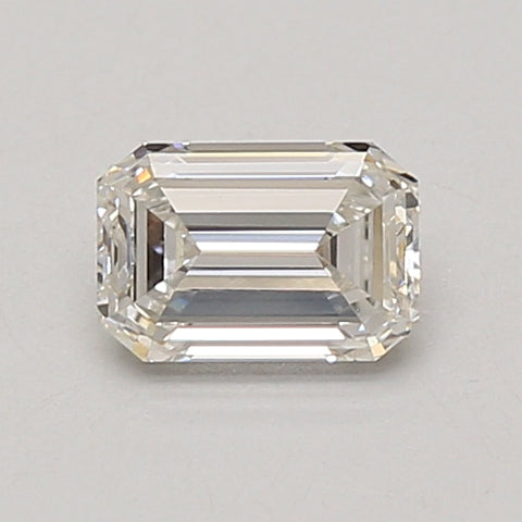 Emerald-cut lab-grown diamond stone with clear facets displayed on neutral background.