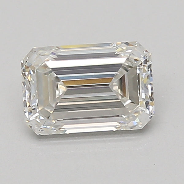 Emerald-cut lab-grown diamond with faceted surfaces and clear coloration on neutral background.