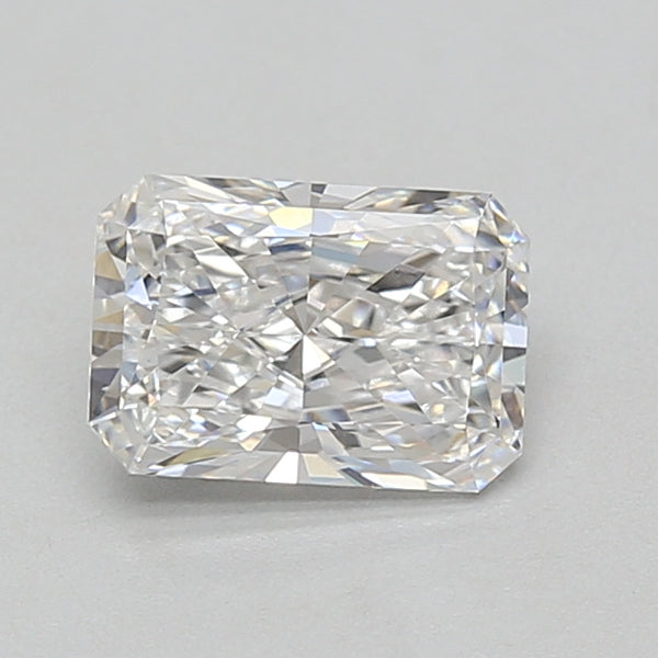 Clear radiant cut lab grown diamond with multiple facets, displayed against a neutral gray background.