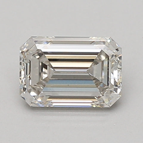 Emerald-cut lab-grown diamond with faceted surfaces and step-cut pattern, displaying light refraction across clear stone.