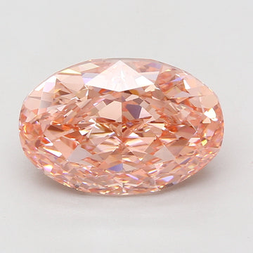 Oval-cut lab-grown diamond with peachy-pink coloring and faceted surface displaying light refraction.