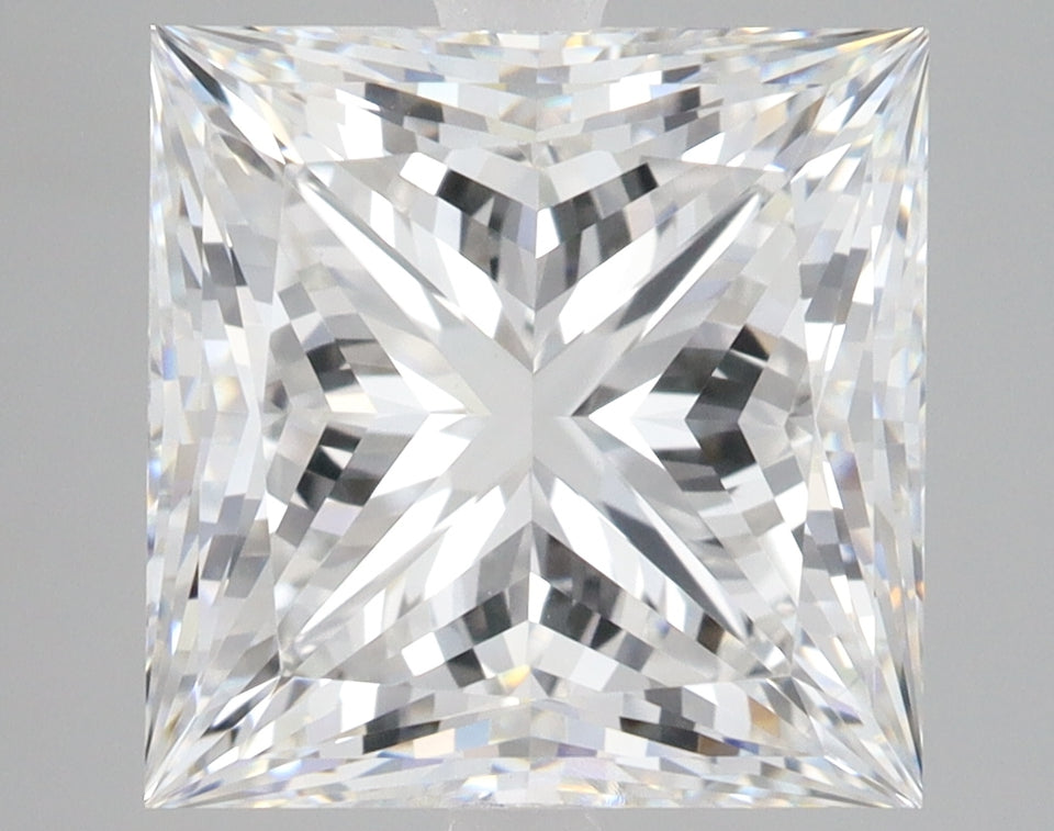 Princess-cut lab-grown diamond with faceted surfaces reflecting light, displayed against neutral background.