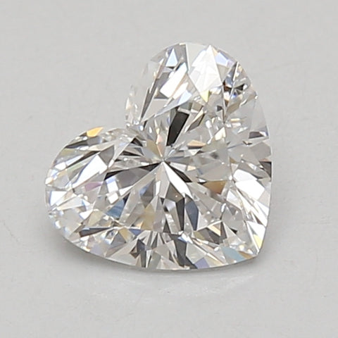 Heart-shaped lab-grown diamond with faceted surface, 0.97 carat, on neutral background.