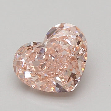 Heart-shaped lab-grown diamond with faceted surface and light peachy-pink color, 1.51 carat.
