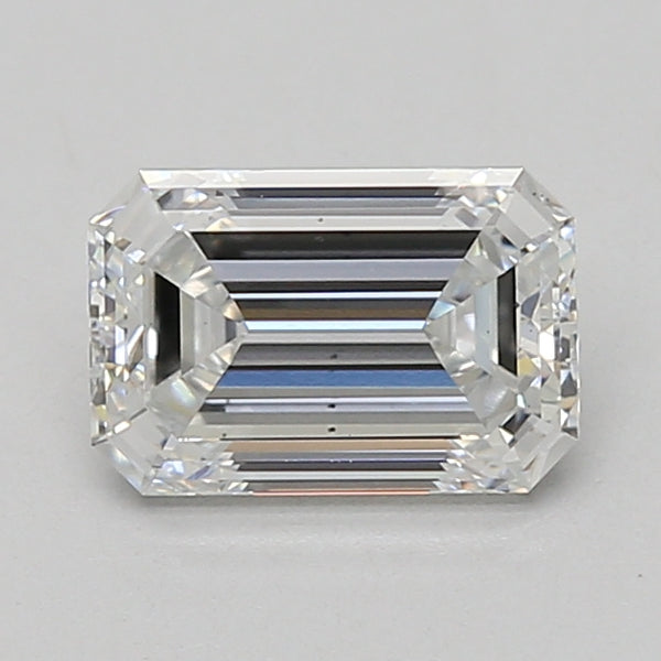 Emerald-cut clear diamond with faceted surfaces and step-cut pattern on neutral background.