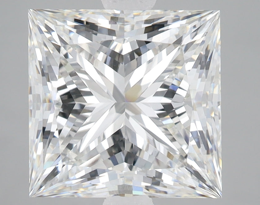 Princess cut lab grown diamond with faceted surface reflecting light, displayed against neutral gray background.