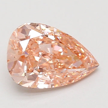 Pear-shaped lab-grown diamond with faceted surface and light peachy-pink tone on neutral background.