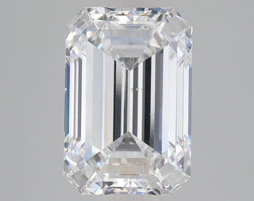 Emerald cut lab-grown diamond with clear facets and reflective surfaces on neutral background.