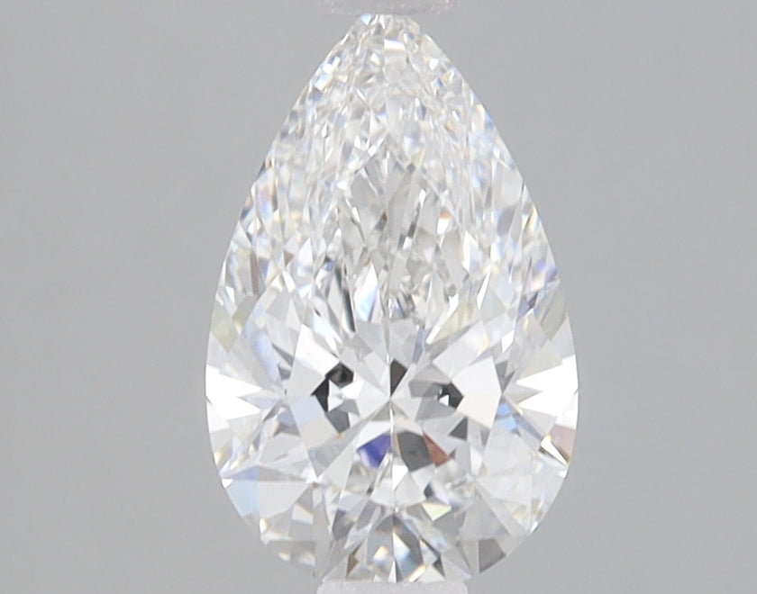 Pear-shaped colorless lab-grown diamond with faceted surfaces and light reflections on gray background.