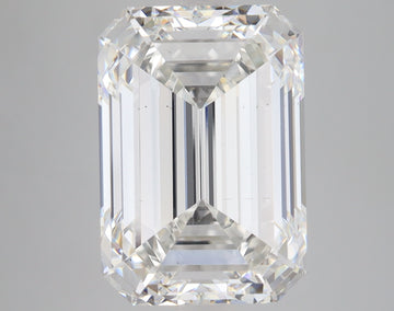 Emerald-cut lab-grown diamond with faceted sides and stepped pavilion, displaying light refraction and clarity against gray b