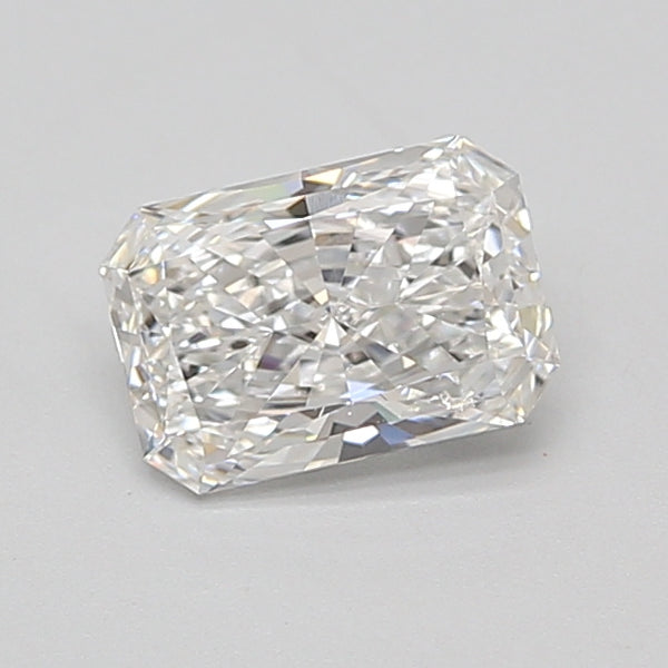Radiant cut loose diamond stone with faceted surfaces and clear coloring on neutral background.
